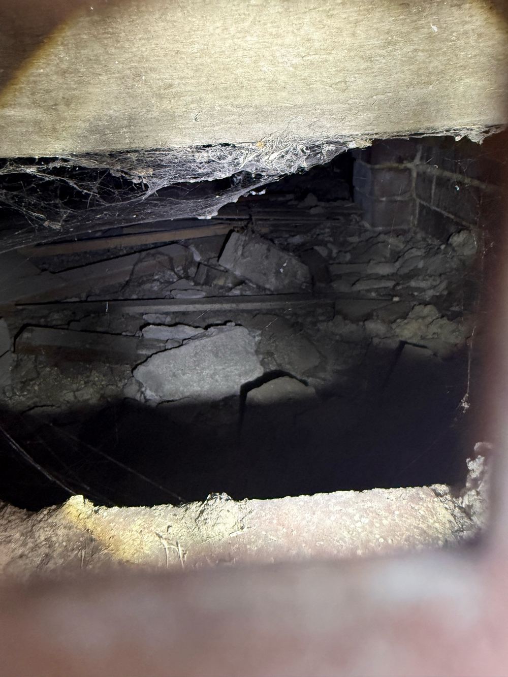 Timber offcuts left on the ground under the building, an open invitation to termites, found during a building and pest inspection in Dandenong North
