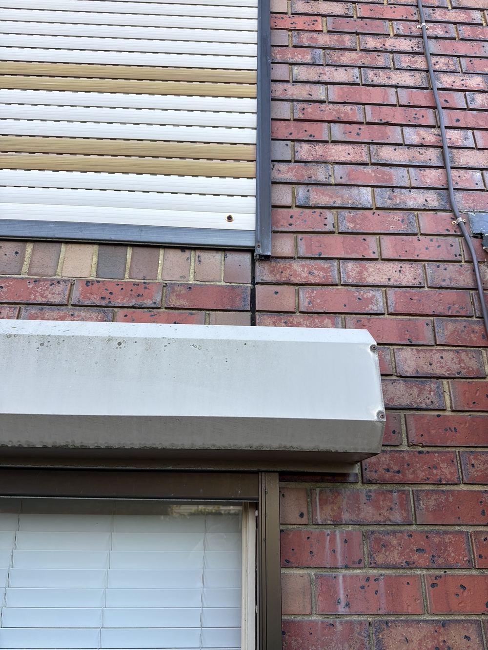 Articulation joints in the brickwork left unsealed, letting water into the wall, found during a defect investigation inspection in Aspendale Gardens