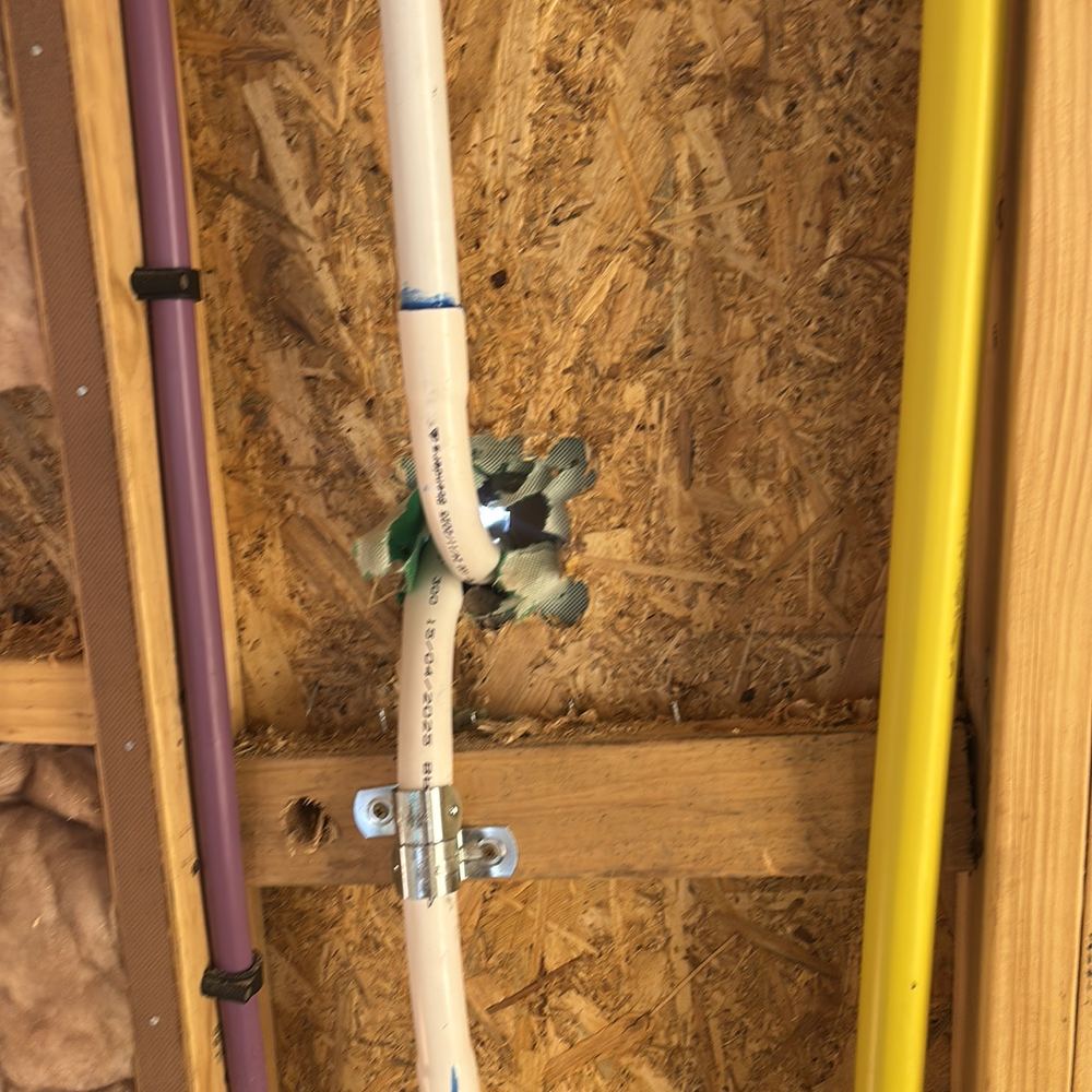 Wall bracing cut through, removing resistance to wind load until it is restored, found during a lock-up inspection in Clyde North