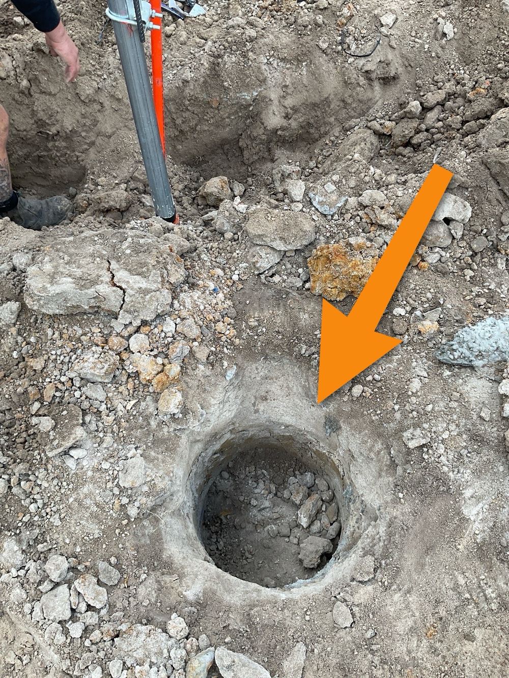 Loose dirt left at the base of a pier hole instead of firm ground, found during a bored pier inspection in Mount Waverley
