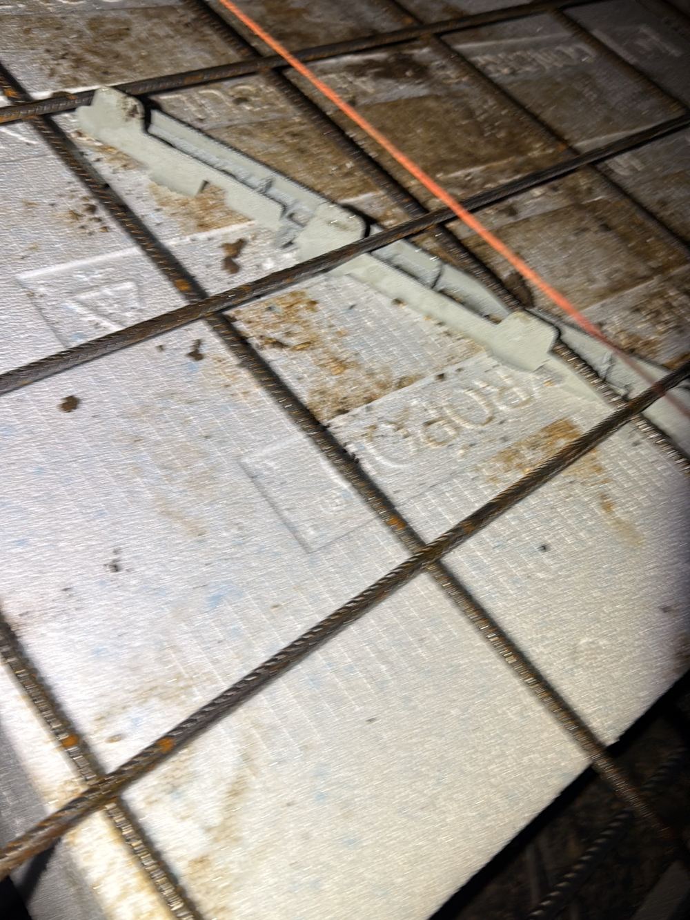Bar chairs out of position, leaving the slab mesh poorly supported, found during a slab pre-pour inspection in Clyde North