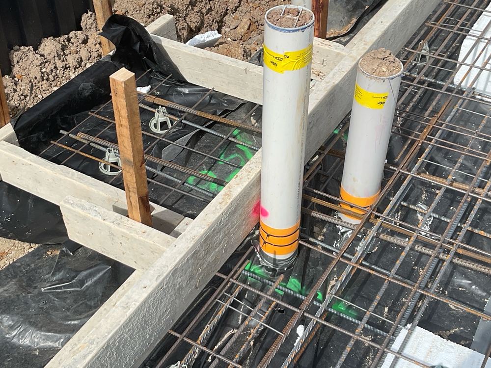 Reinforcement sitting too close to the edge for the required concrete cover, found during a slab pre-pour inspection in Clyde North