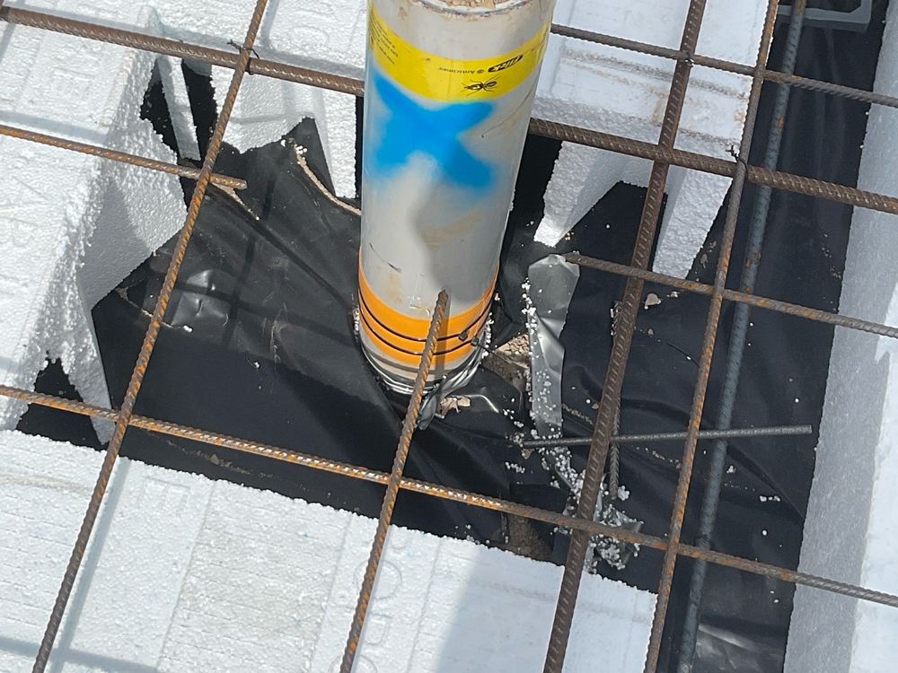 Service pipes through the vapour barrier left untaped and unsleeved, found during a slab pre-pour inspection in Clyde North