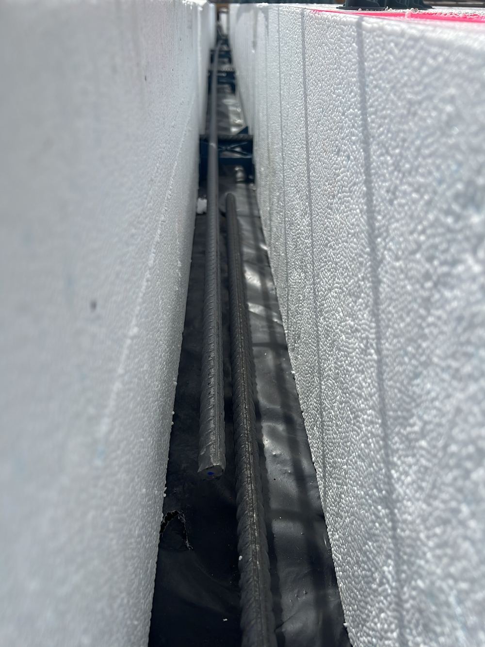 Reinforcement splices in the internal ribs left untied before the pour, found during a slab pre-pour inspection in Clyde North