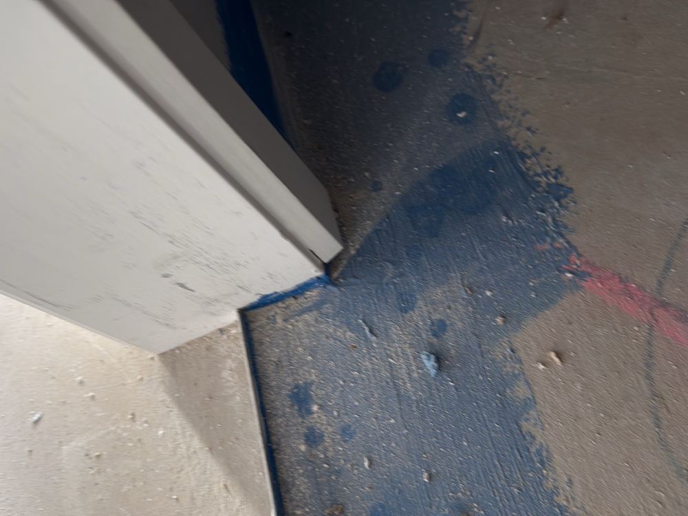 Water stop angle at the door not run out to meet the perimeter flashing, Clyde North